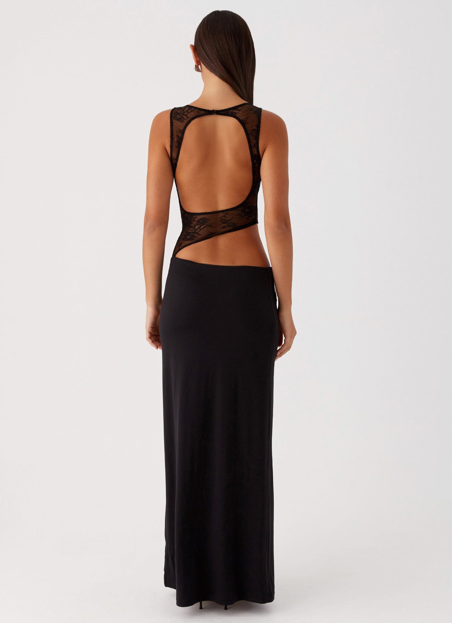 Back view black maxi dress featuring open back cutout, sheer lace bodice, sleeveless fit
