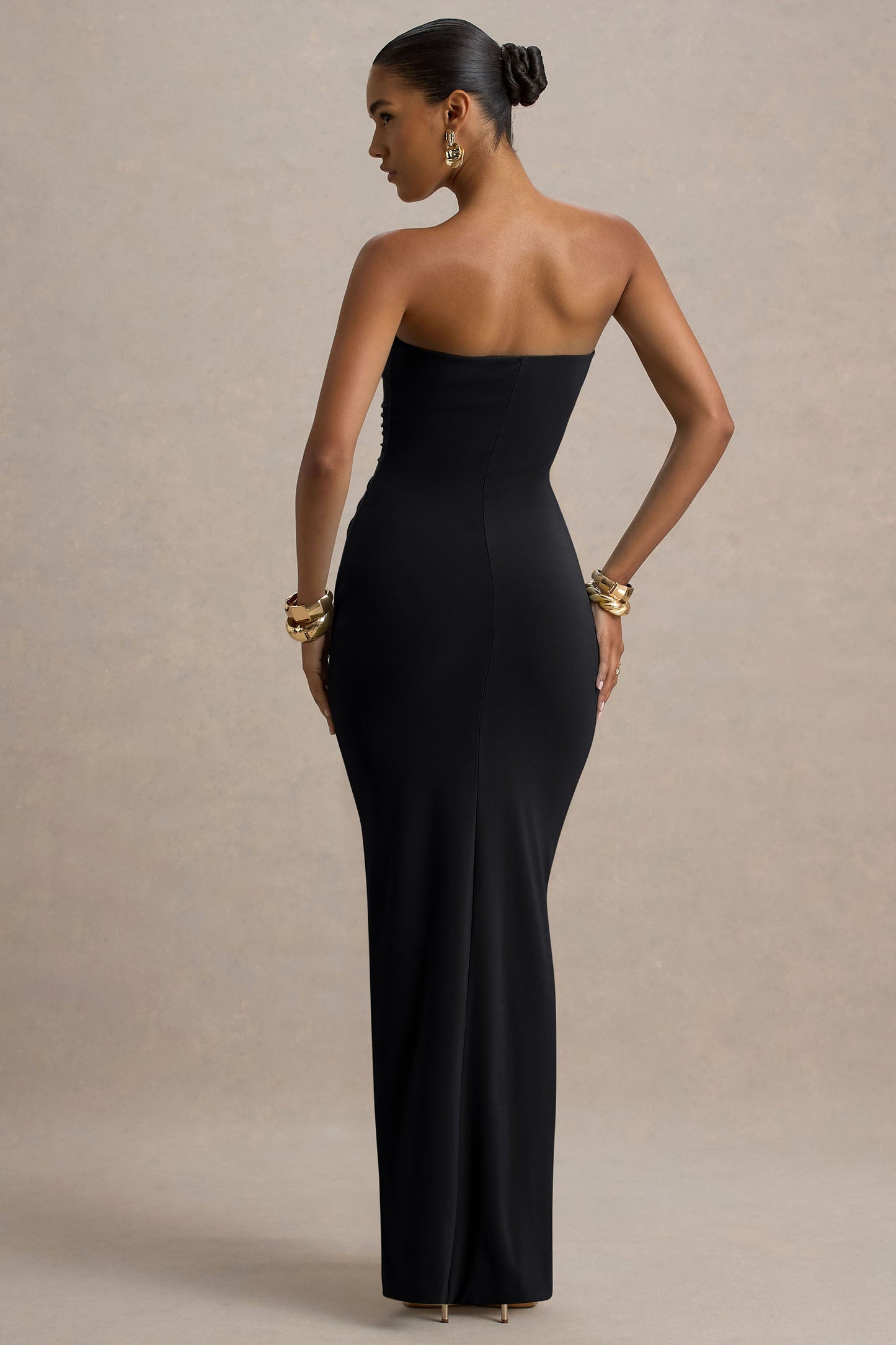 Back view of black off shoulder slinky jersey maxi dress with smooth strapless back and maxi skirt