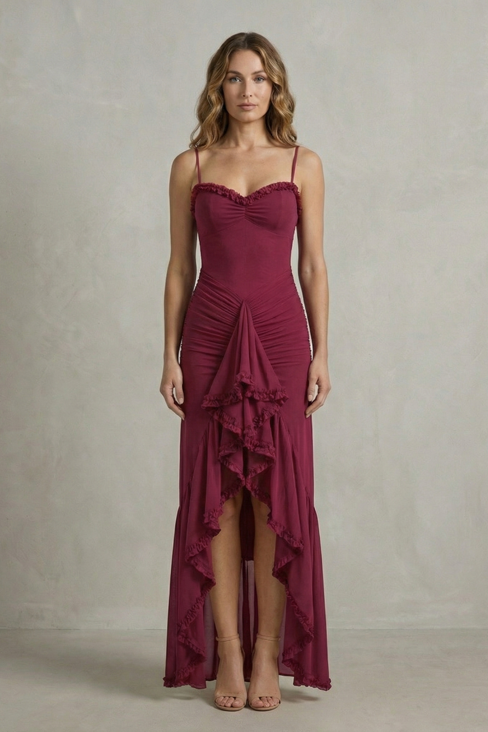 Full-length view of a women's elegant burgundy ruched ruffle maxi dress, showcasing the intricate ruching details and tiered ruffles on the skirt, ideal for vacation outfits.
