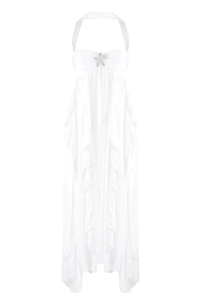 White strapless ruched ruffle maxi dress with a halter neckline and a prominent silver star detail on the bodice.