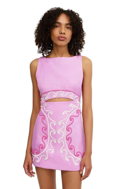 Front view of a sleeveless women's mini dress in light purple with waist cut-out and intricate pink and white embroidery.