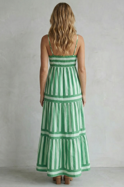 Back view of the green and white striped tiered maxi dress, showing the smocked detail on the back bodice.
