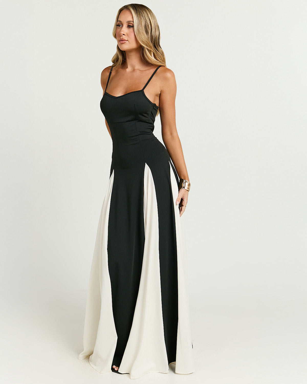 Three-quarter view of the black and white panel maxi dress for women, showing the intricate paneling and the comfortable, flowing fabric, suitable as a beach dress for women.