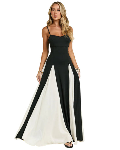 Women's black and white panel maxi dress with spaghetti straps, featuring a fitted bodice and a flowing A-line skirt with alternating color panels, perfect for vacation outfits.