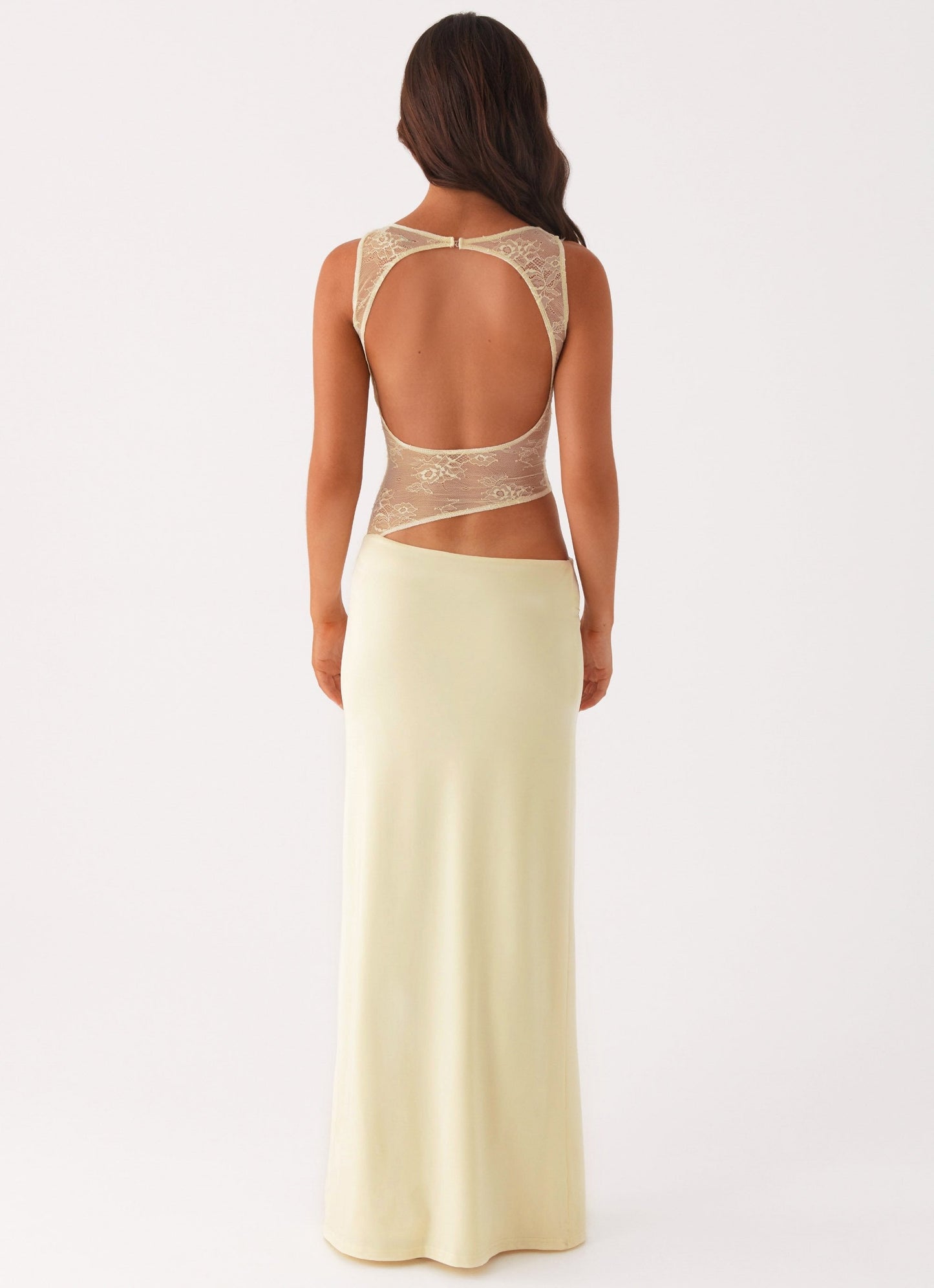 Back view cream maxi dress showing large open back cutout and sheer lace bodice detail