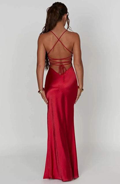 Back view of red satin maxi dress with crisscross straps and tie detail