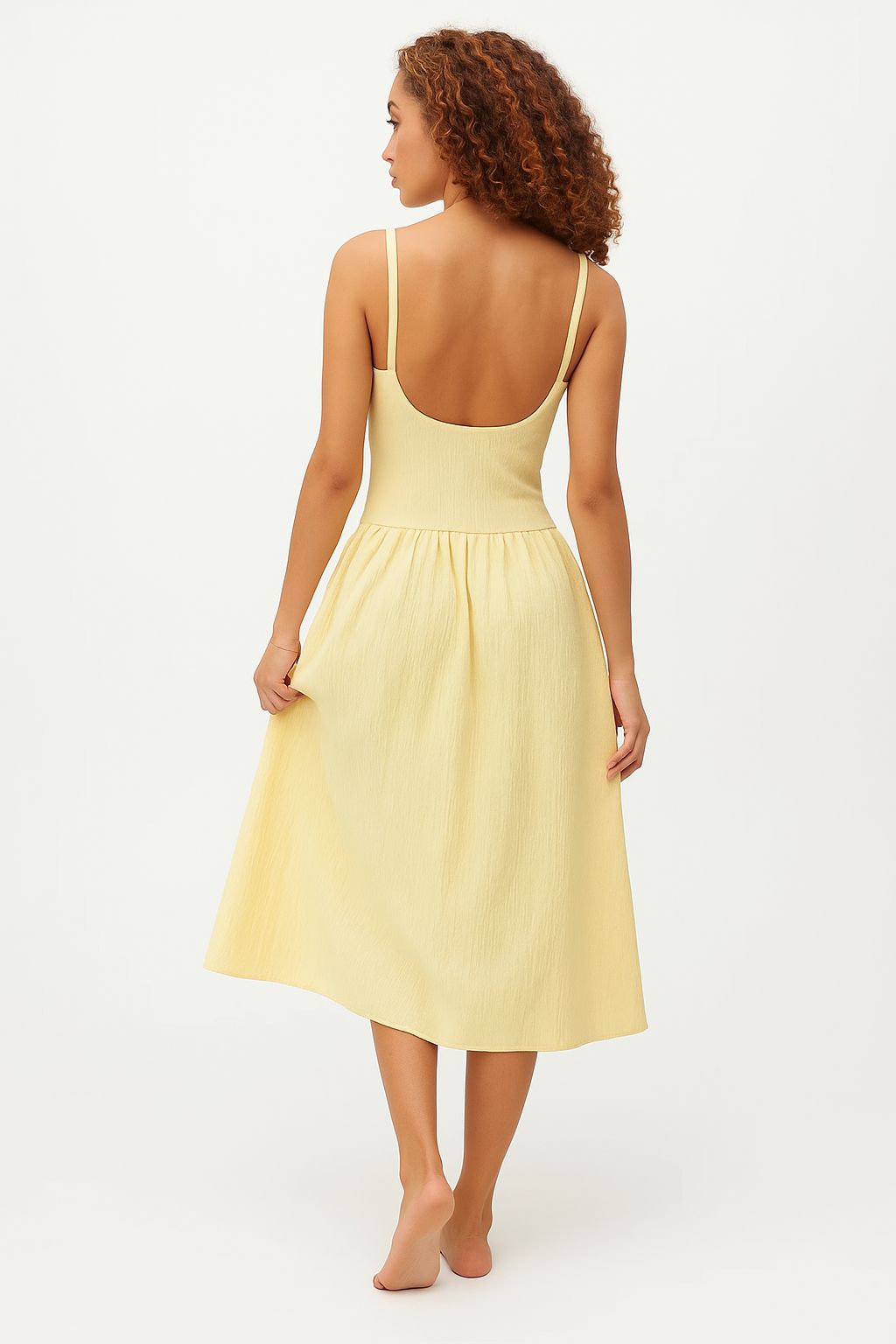 Women light yellow cocktail midi dress angled side view with square neckline, low back, textured finish, gathered waist