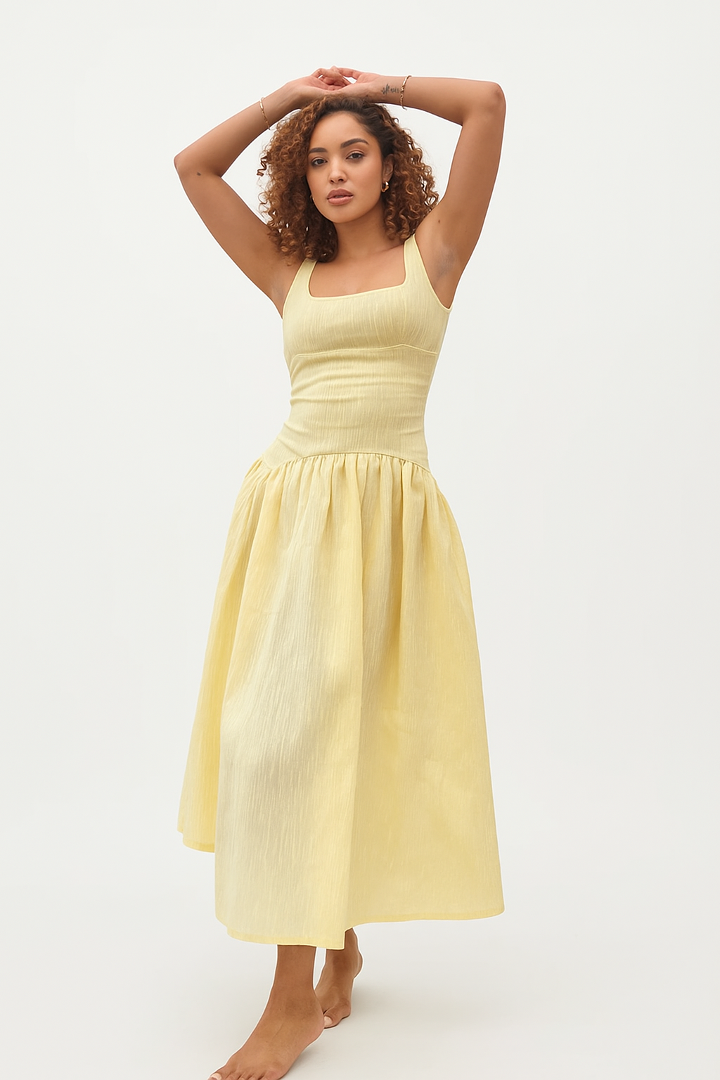 Women light yellow cocktail midi dress front view with square neckline, wide straps, fitted bodice, gathered skirt