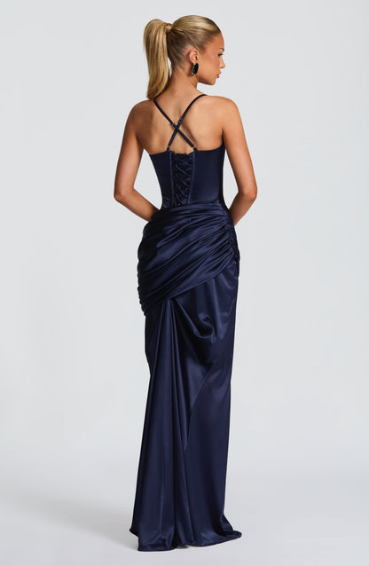 Angled back navy satin corset maxi dress featuring lace-up panel and ruched draped hip detail