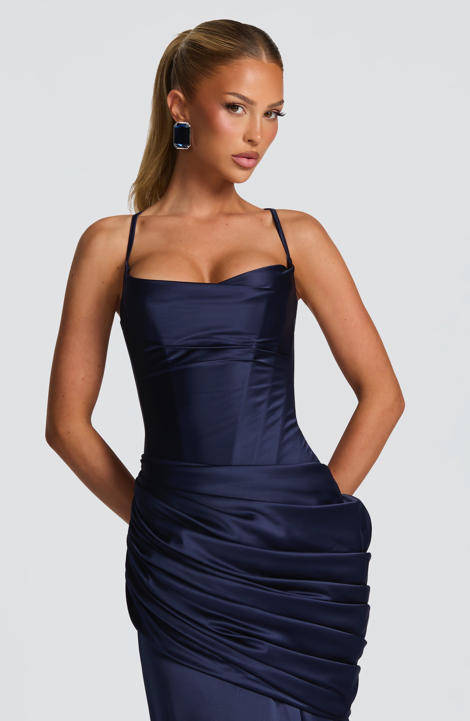 Navy satin corset maxi dress with spaghetti straps and sweetheart neckline, close-up bodice