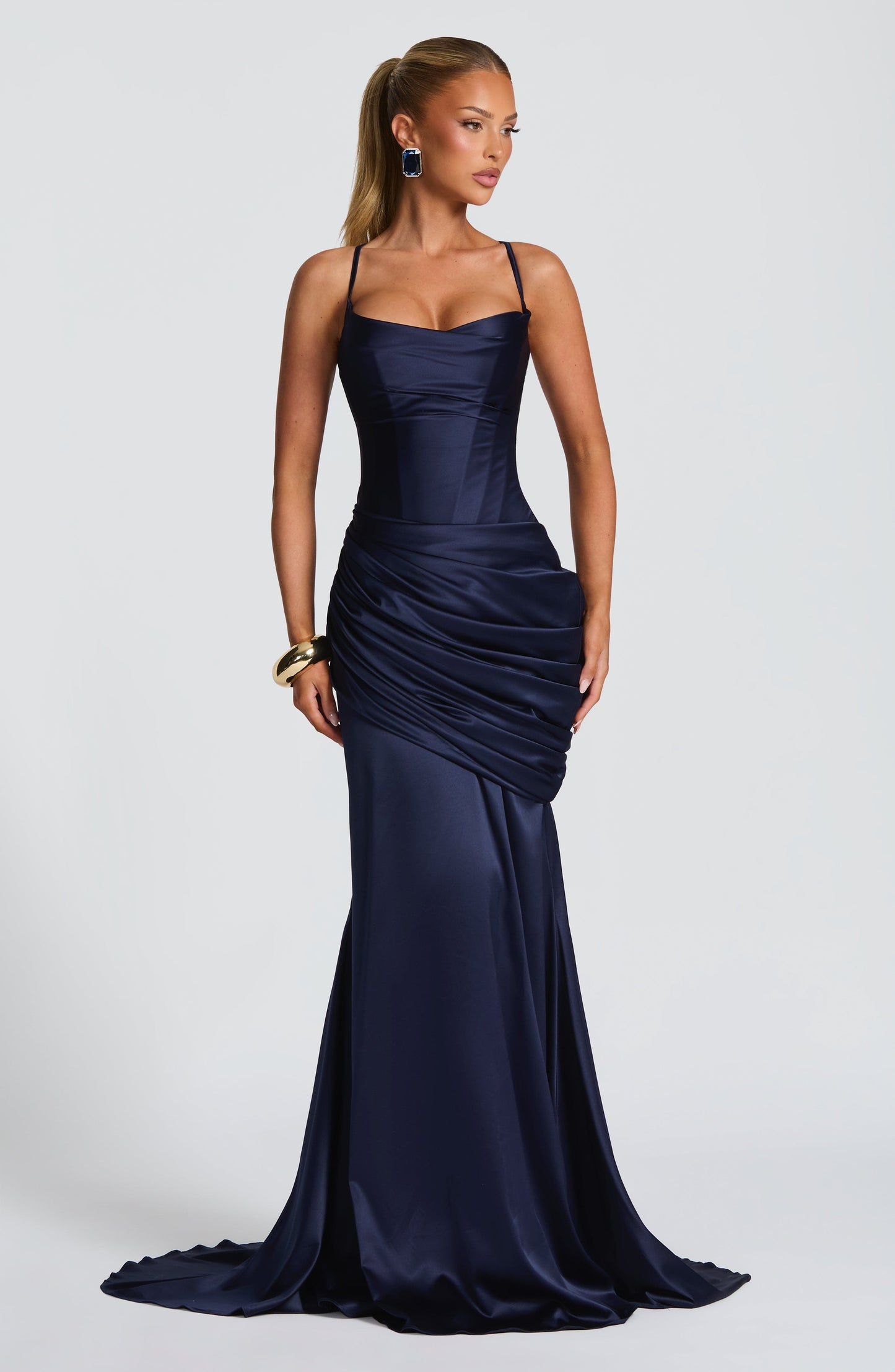 Full length navy satin wedding guest maxi dress with corset fit and ruched drape skirt, train