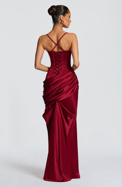 Three-quarter back burgundy satin corset maxi dress with lace-up back and gathered drape