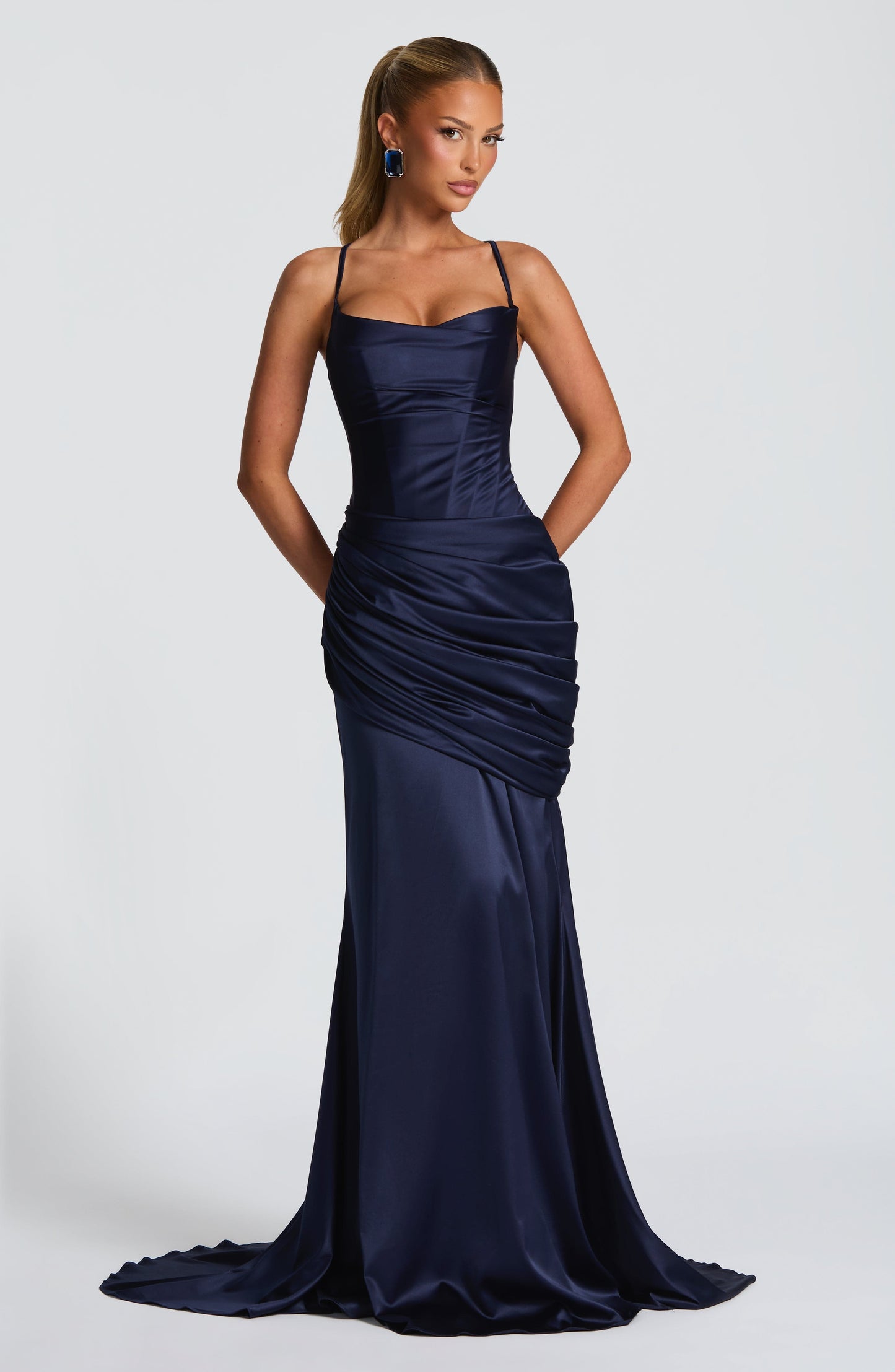 Navy satin corset maxi dress with spaghetti straps and draped skirt, wedding guest front view