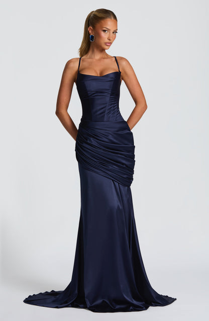 Navy satin corset maxi dress with spaghetti straps and draped skirt, wedding guest front view