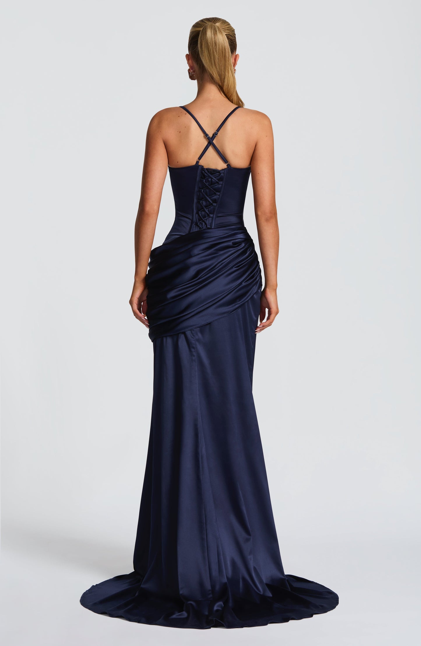 Back view navy satin maxi dress with lace-up corset back and crossed adjustable straps