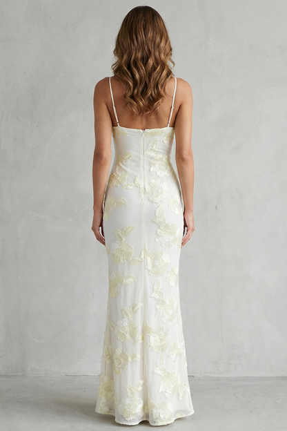 Back view of the white floral appliqué scoop neck maxi dress with thin straps, highlighting the elegant silhouette.