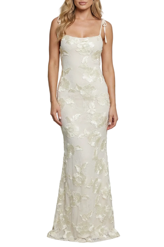 Elegant white floral appliqué maxi dress with delicate spaghetti straps and scoop neck, ideal for wedding guests.