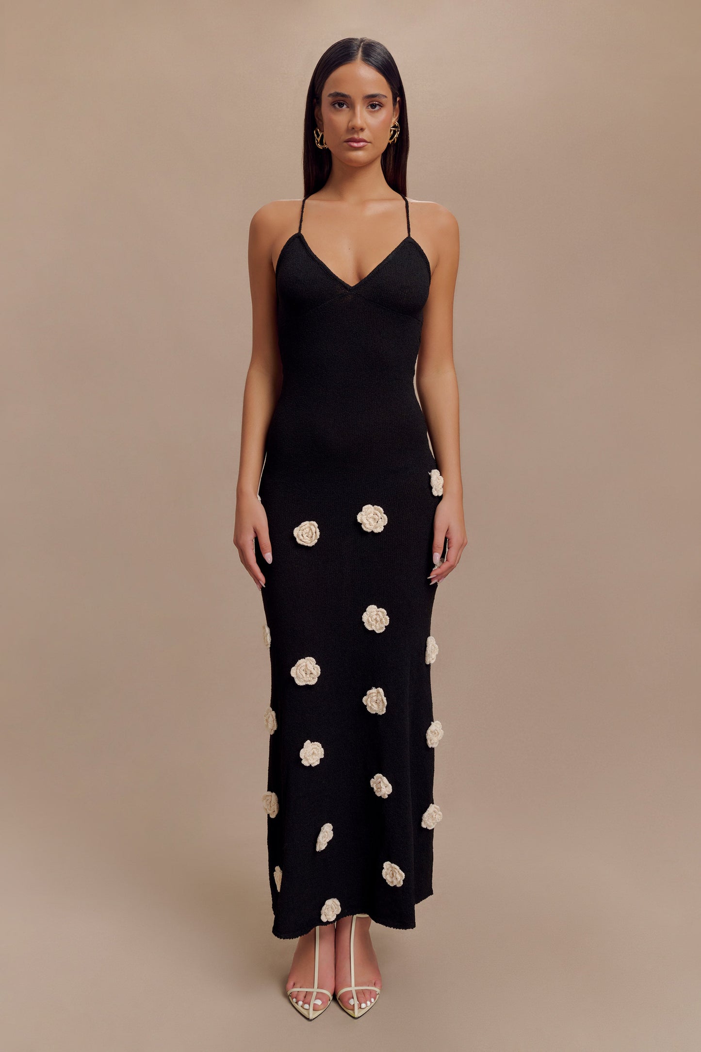 Black knit maxi dress for women with spaghetti straps and white floral crochet appliques, front view
