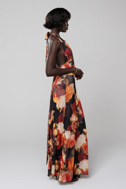 Side view of the vibrant floral halter maxi dress, showcasing the open back and flowing silhouette, a stunning choice for wedding guest dresses.