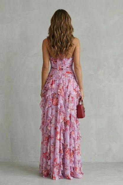 Back view of the purple floral halter maxi dress, showing the open back detail and tiered ruffles.