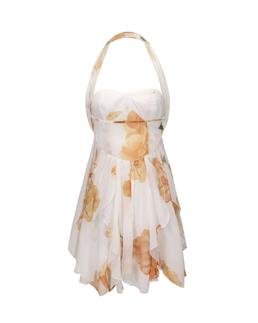 Back view of women's floral halter neck tiered mini dress in white with orange and brown flowers and a ruffled skirt.
