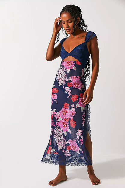 Front view of a women's navy blue floral lace cut out back maxi dress with a prominent pink and red floral pattern, great for beach dress for women.