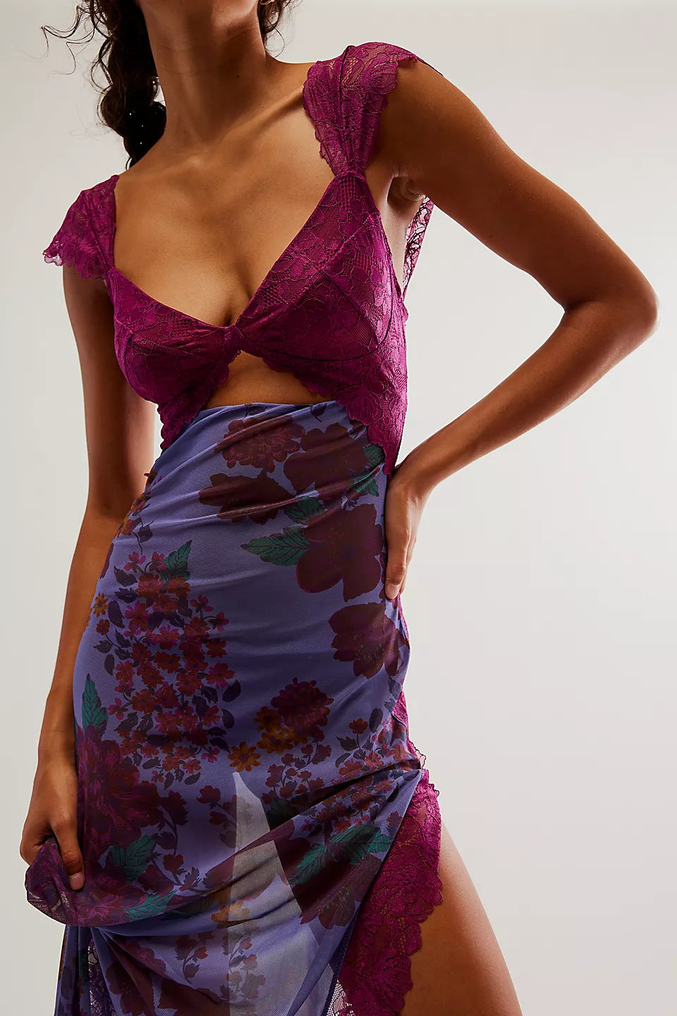 Close-up of a women's purple floral lace cut out back maxi dress, showing the lace bodice and sheer skirt with deep floral print.