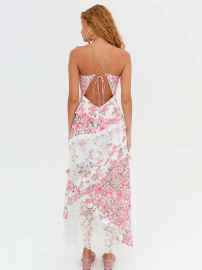 Back view of women's white and pink floral lace V-neck maxi dress with criss-cross back and ruffles