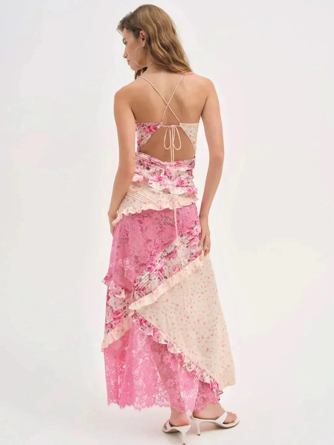 Back view of pink floral lace V-neck maxi dress with criss-cross straps and ruffled details, perfect for wedding guests