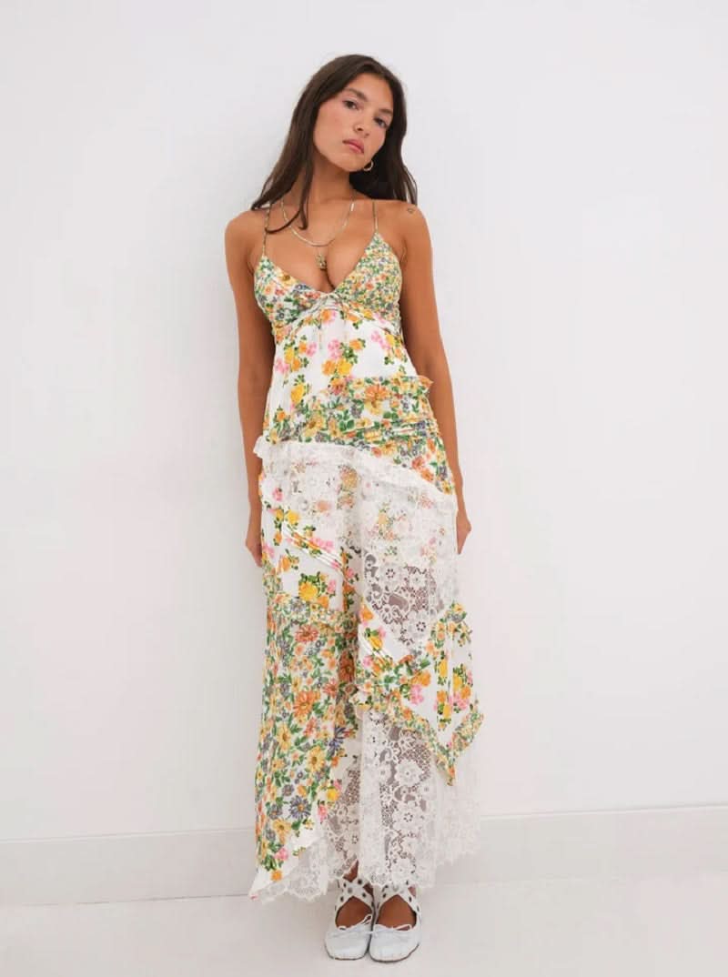 Front view of women's floral lace V-neck maxi dress in yellow and orange print with white lace panels