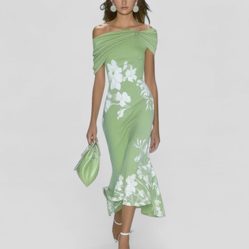 Light green off-shoulder midi dress with white floral print, ruched bodice, and high-low mermaid hem. Perfect vacation dress.