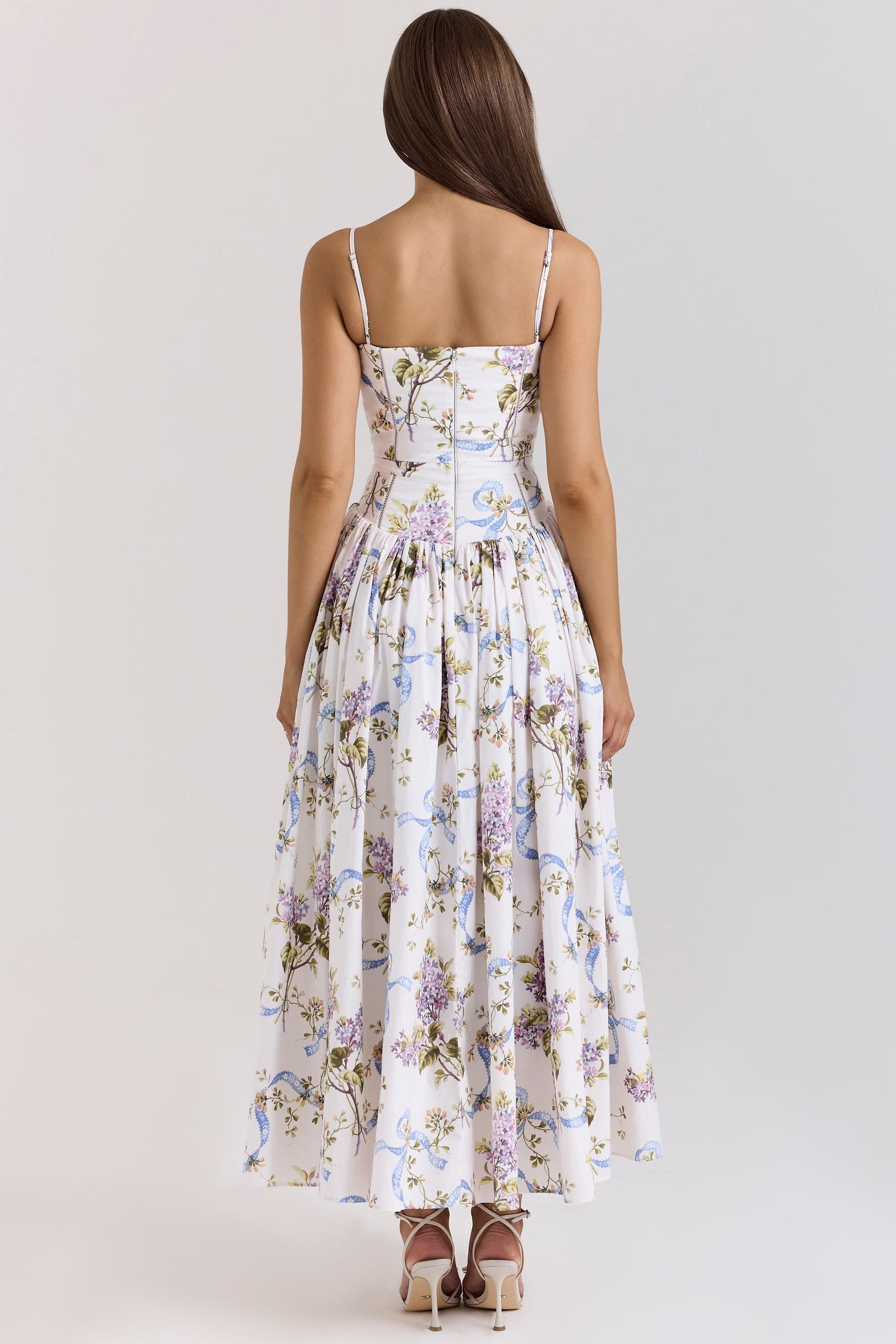 Back view of a white floral printed midi dress for women, featuring a square neck and delicate spaghetti straps.