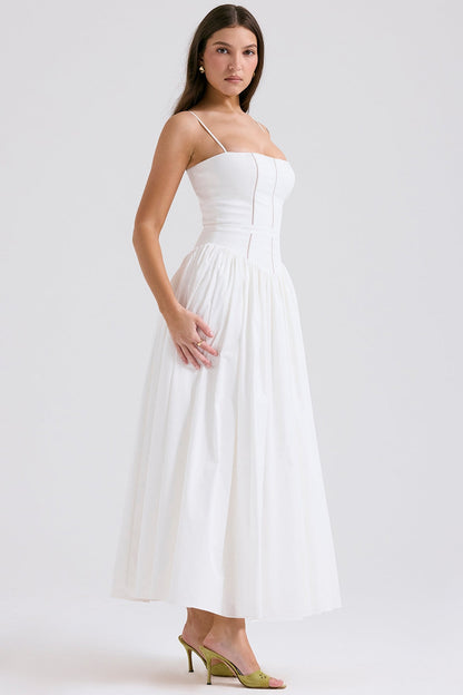 Side view of a white square neck midi dress with a structured bodice and full skirt, suitable for elegant wedding guests.