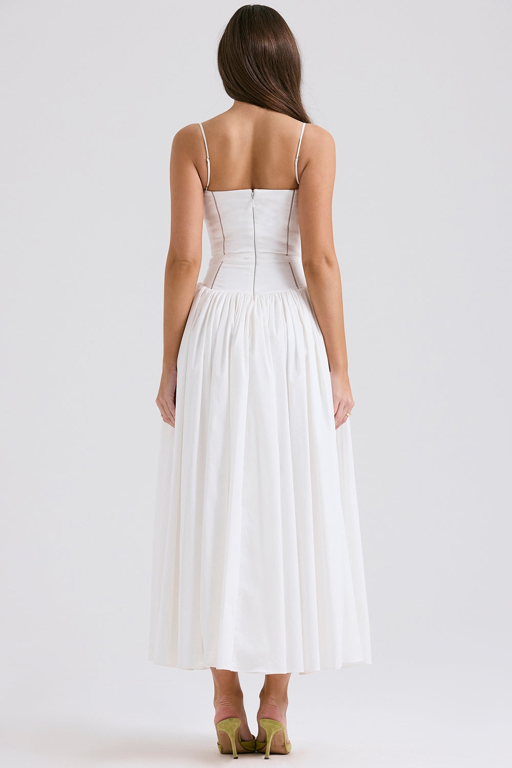 Back view of a white square neck midi dress with a clean, simple design and a full, elegant skirt.