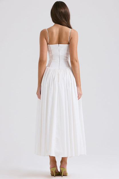 Back view of a white square neck midi dress with a clean, simple design and a full, elegant skirt.