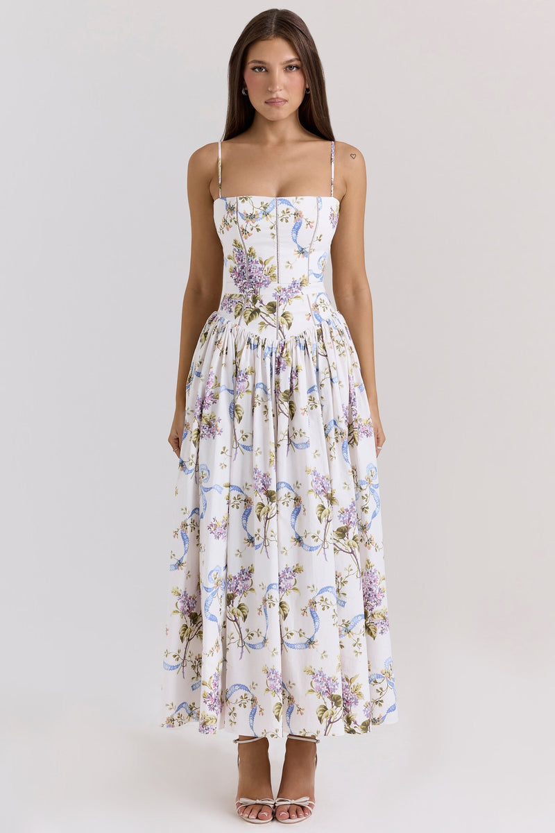 Front view of a women's white midi dress with purple floral and blue ribbon print, square neck, and spaghetti straps.