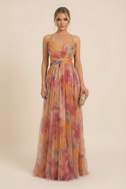 Women's floral v-neck maxi dress with cut-outs and spaghetti straps, featuring a vibrant pink and orange watercolor pattern.