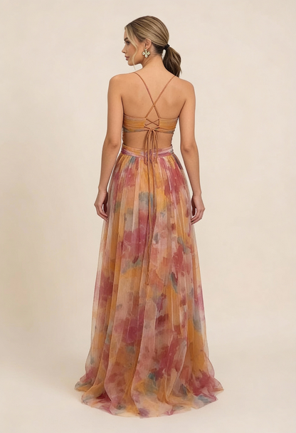 Back view of a women's floral maxi dress with a lace-up back detail and cut-outs, perfect for vacation outfits.