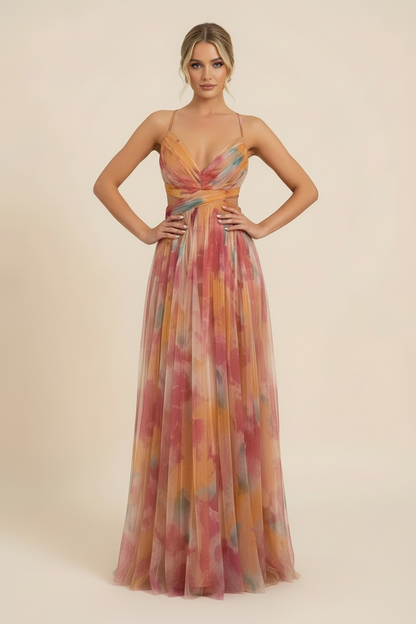 Front view of a women's floral v-neck maxi dress, highlighting the pleated skirt, cut-out waist, and colorful pattern.