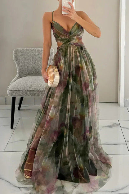 Women's green floral v-neck maxi dress with side cut-outs, a high slit, and a flowing skirt, ideal for vacation dresses.