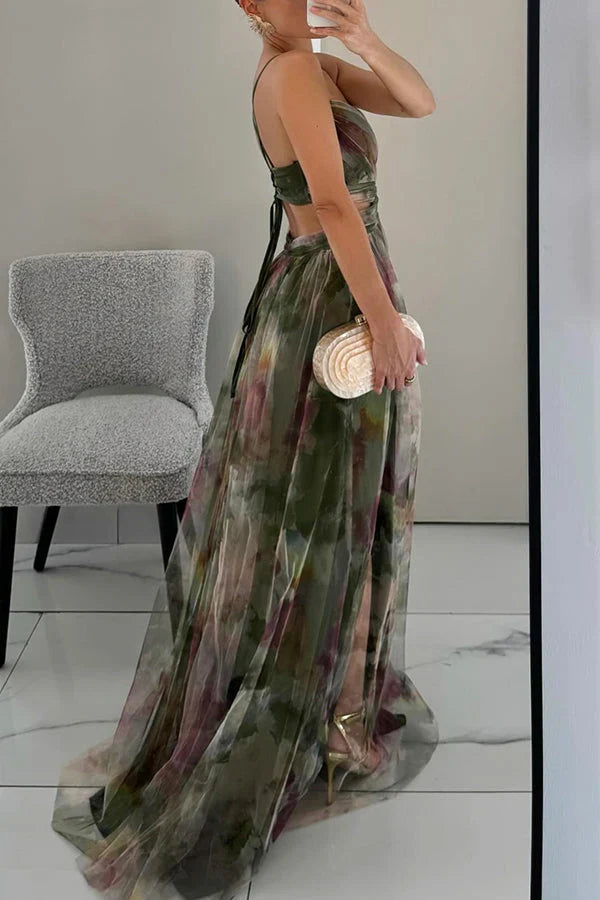 Side and back view of a women's green floral maxi dress, showing the lace-up back and flowing skirt with a high slit.