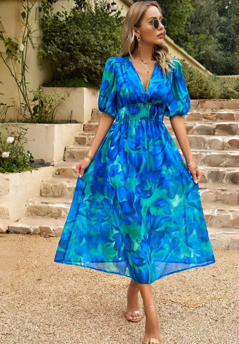 Front view of the women's blue and green floral v-neck midi dress, highlighting the vibrant pattern and flattering silhouette.