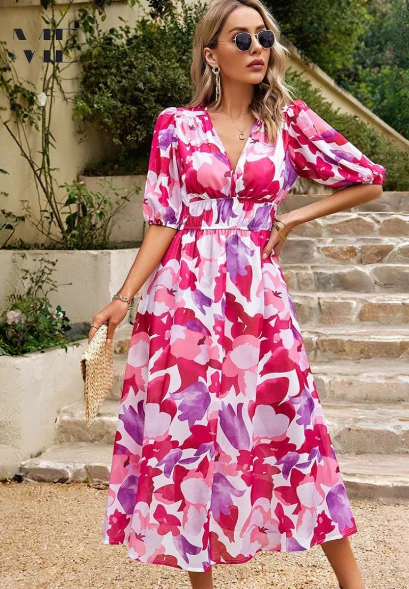 Side profile of the women's pink and purple floral v-neck short sleeve midi dress, displaying the elegant V-neckline and comfortable design.