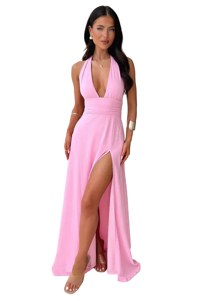 Pink halter neck maxi side slit dress with deep V neckline and floor-length skirt, front view