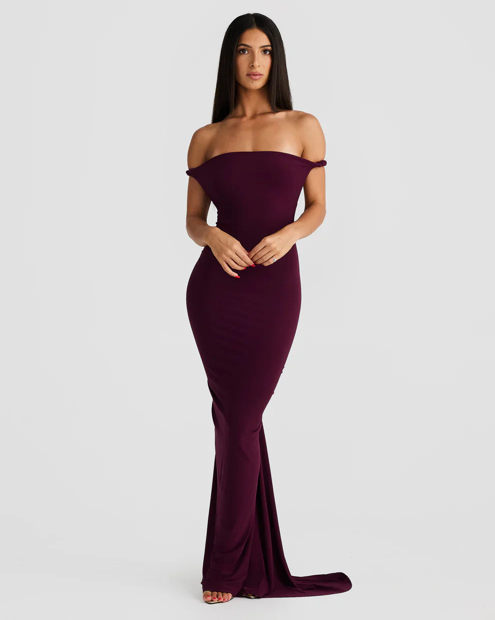 Plum bodycon maxi dress with off-shoulder neckline and floor-sweeping fitted skirt