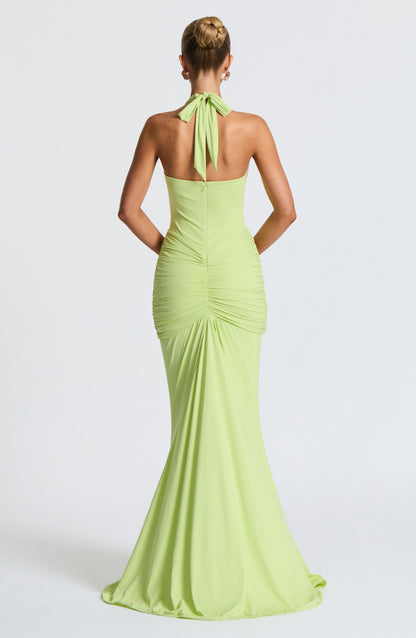 Back view lime green halter maxi dress with tie neck, fitted ruched skirt, and center back seam