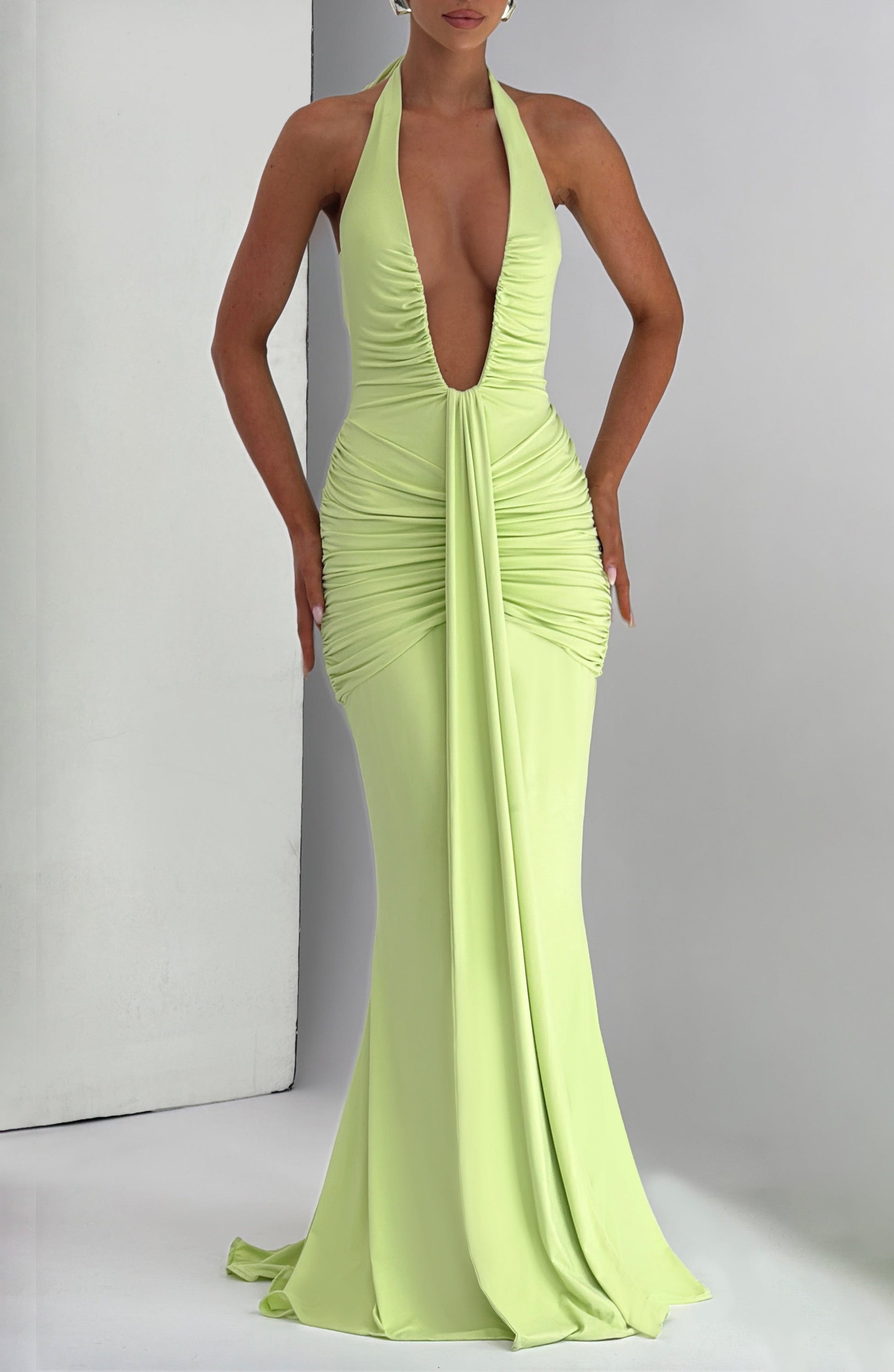Lime green plunge halter ruched bodycon maxi dress with center drape and floor-length hem