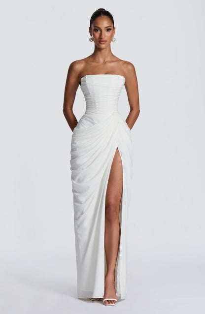 White formal strapless draped maxi dress with thigh slit, straight-on full-length silhouette