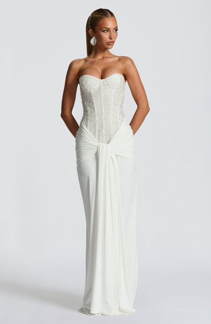 White strapless sequin corset maxi dress with ruched waist and front drape detail, full length view