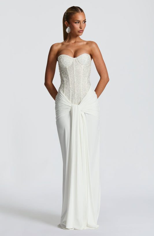 White strapless sequin corset maxi dress with ruched waist and front drape detail, full length view